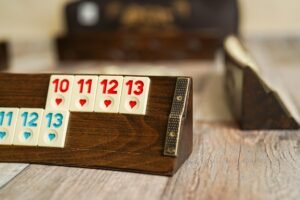 Complete Oval Okey Rummy set with 106 tiles and 4 curved wooden racks