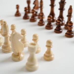Medium wooden chess pieces arranged for a chess game